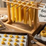 Homemade fettuccine hanging on pasta drying rack
