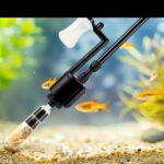 Affordable aquarium gravel cleaner removing debris from a freshwater fish tank.